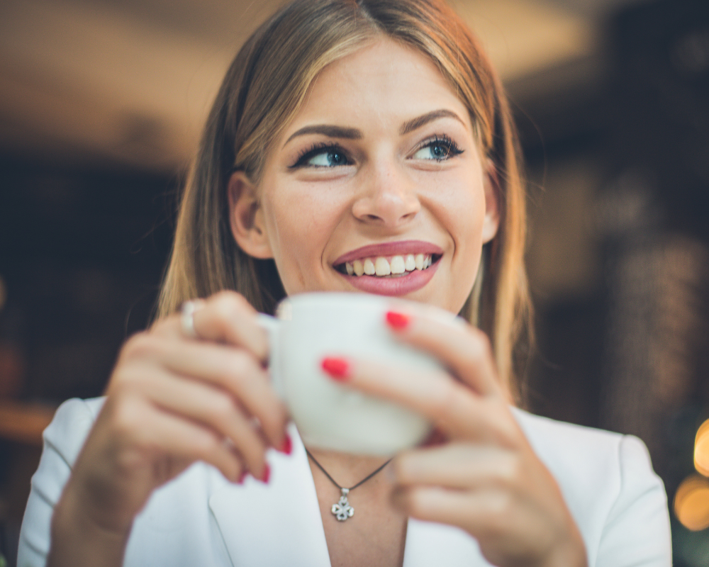 Woman sipping on cup, mindshift transformation
